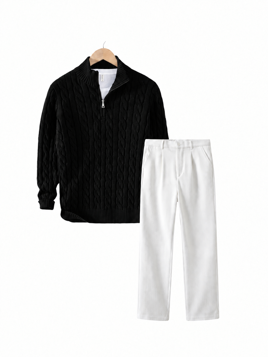 Black cable knit quarter zip with white corduroy wide leg trousers